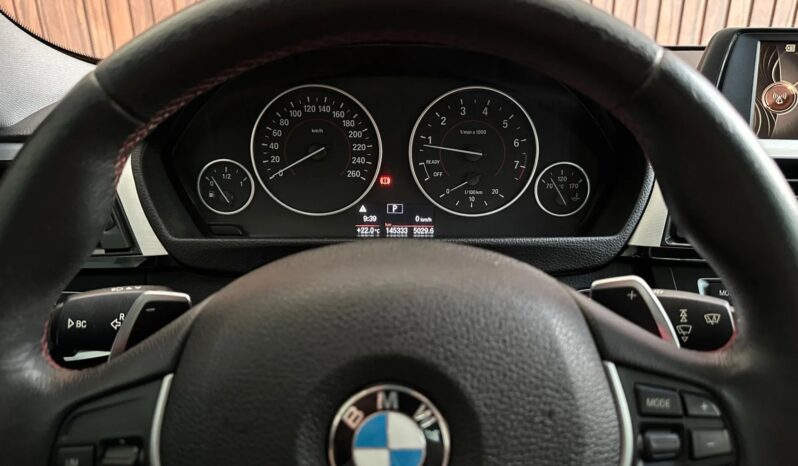 
								BMW 320i cheio									